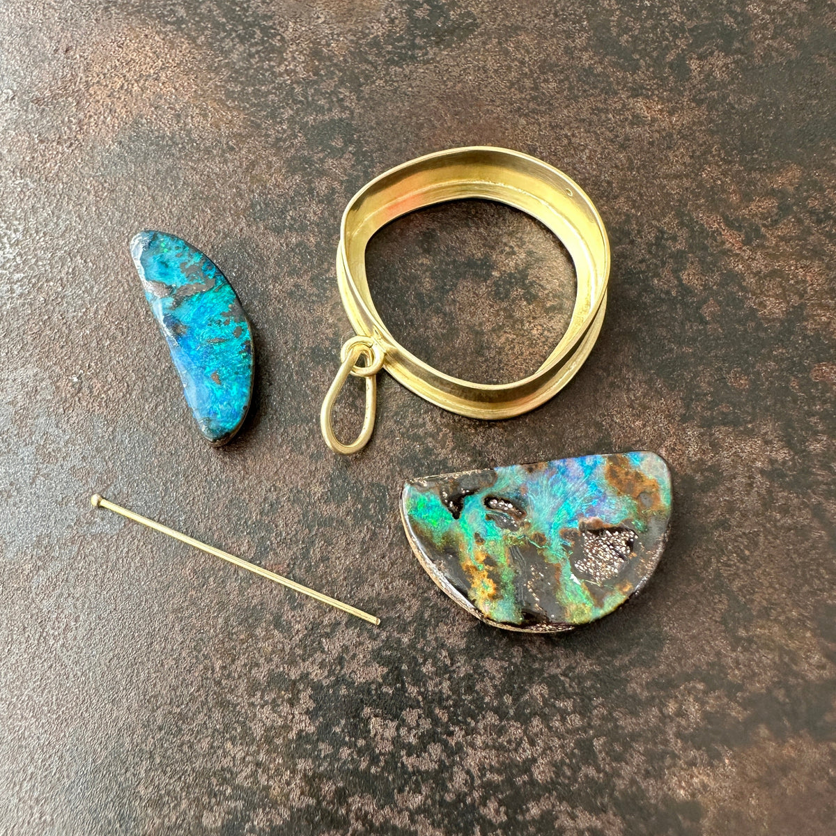 gold pendant with two boulder opals