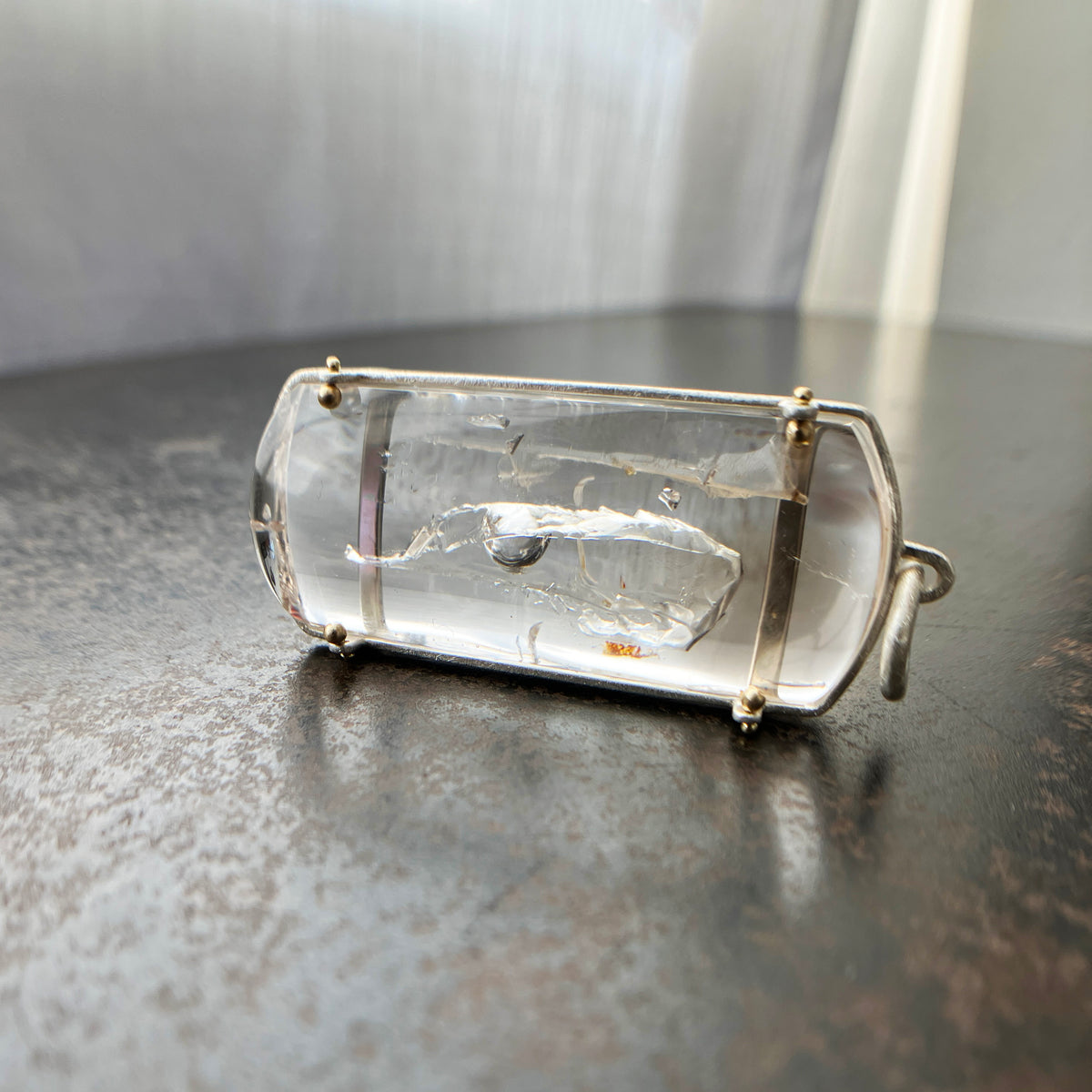 enhydro quartz pendant in silver and 18k gold