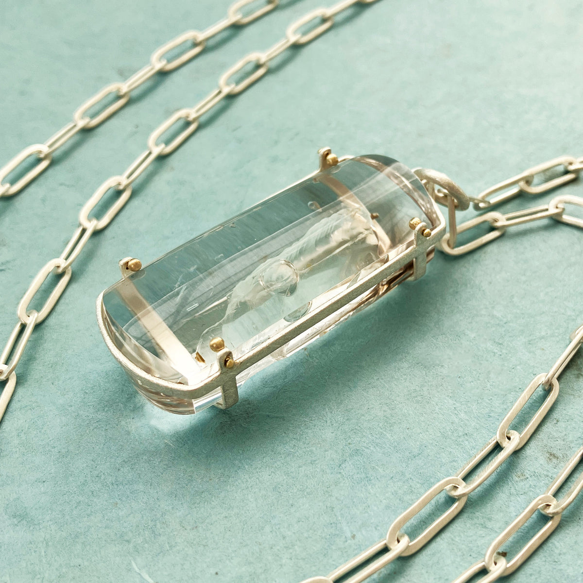 enhydro quartz pendant in silver and 18k gold