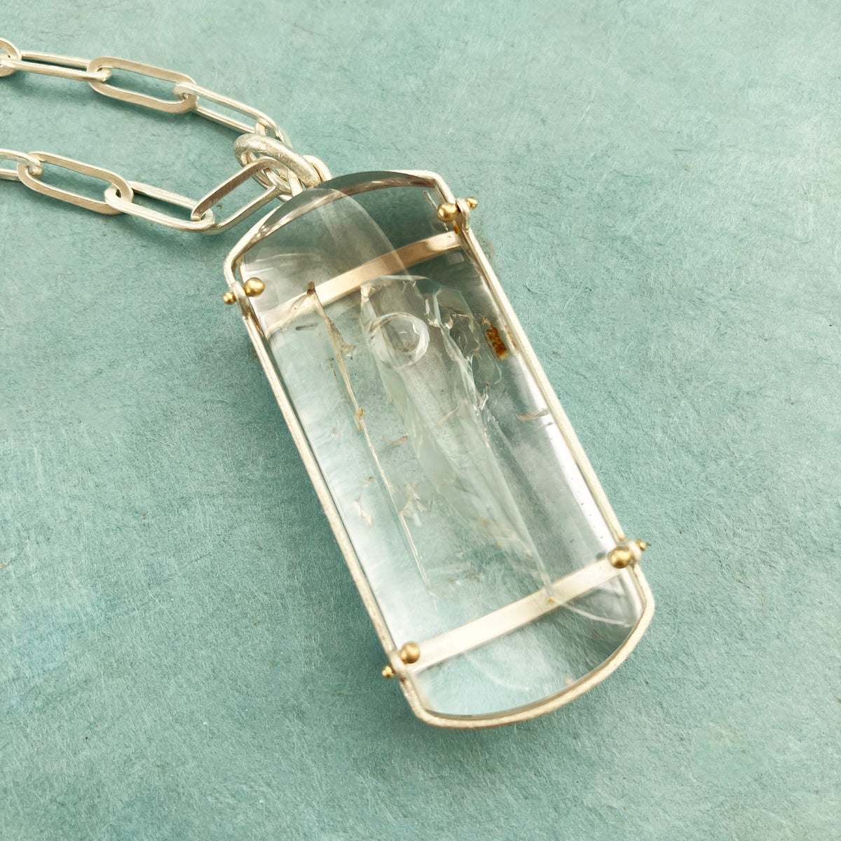 enhydro quartz pendant in silver and 18k gold