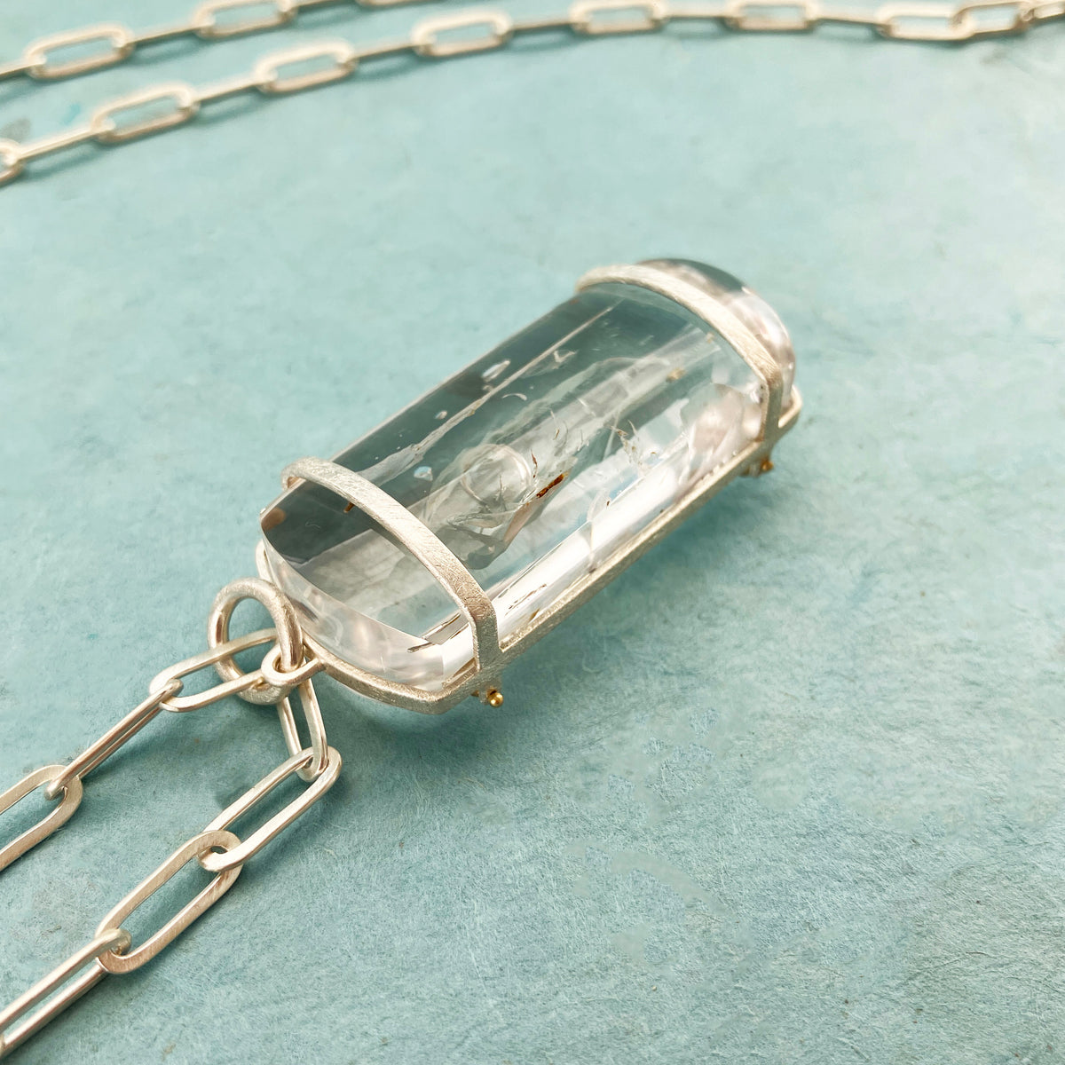 enhydro quartz pendant in silver and 18k gold