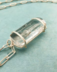 enhydro quartz pendant in silver and 18k gold