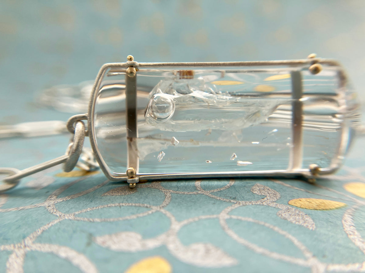 enhydro quartz pendant in silver and 18k gold