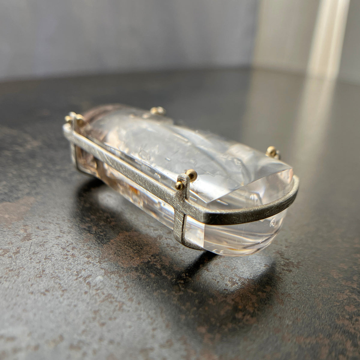 enhydro quartz pendant in silver and 18k gold