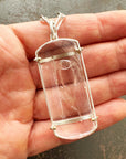 enhydro quartz pendant in silver and 18k gold