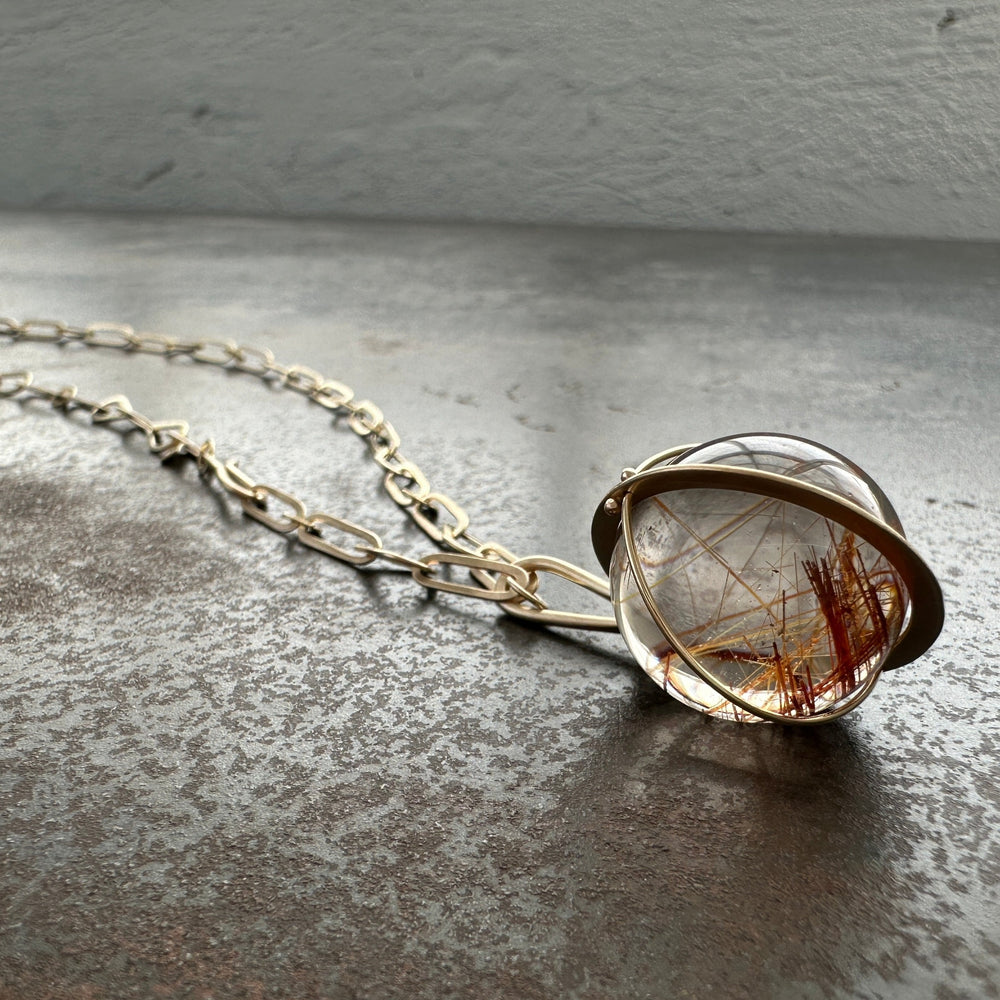 
                
                    Load image into Gallery viewer, Captured Golden Rutilated Quartz Orb
                
            