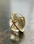 golden rutilated quartz orb pendant captured in 18k gold