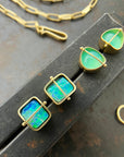 peruvian blue opal round studs in 18k gold