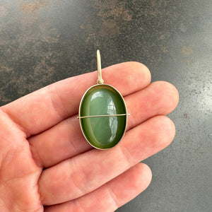 
                
                    Load image into Gallery viewer, Captured Siberian Cat&amp;#39;s Eye Nephrite Jade Charm
                
            
