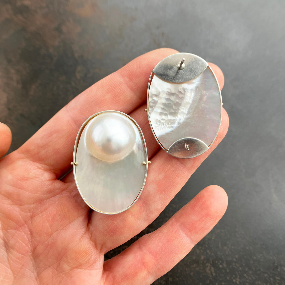 oval mabe pearl earrings set in sterling silver with 14k gold ball rivets