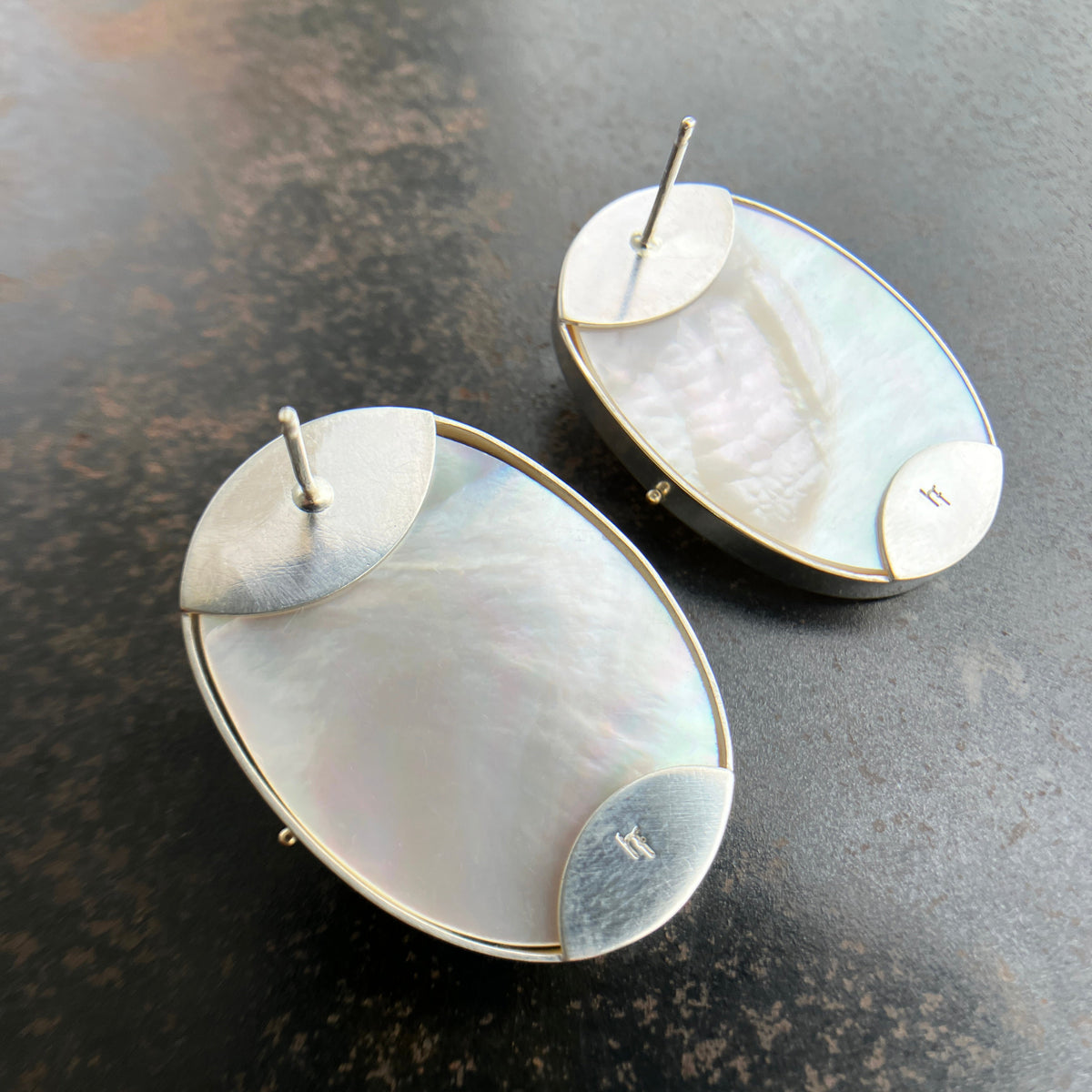 oval mabe pearl earrings set in sterling silver with 14k gold ball rivets