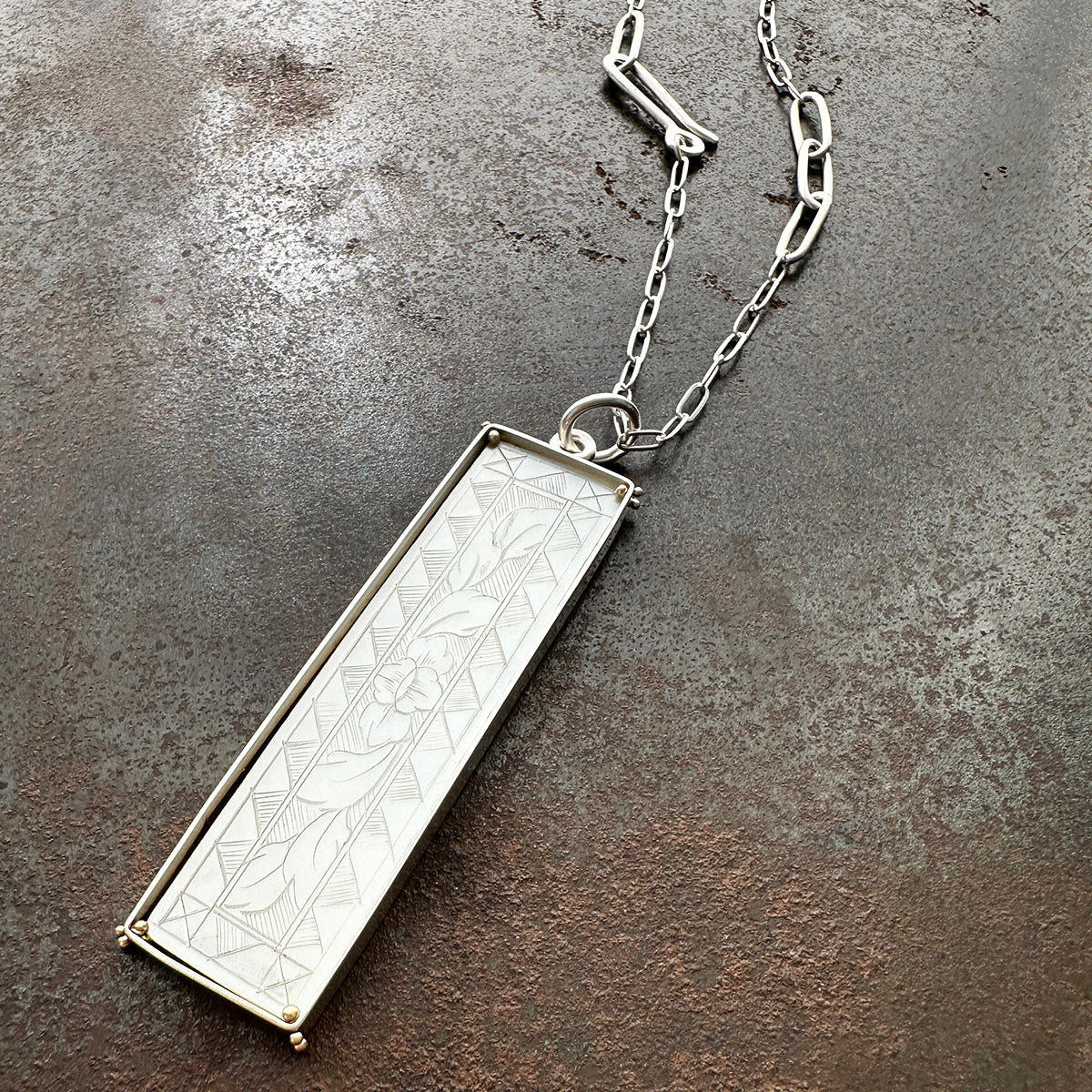 mother of pearl carved pendant with silver 3 way paperclip chain