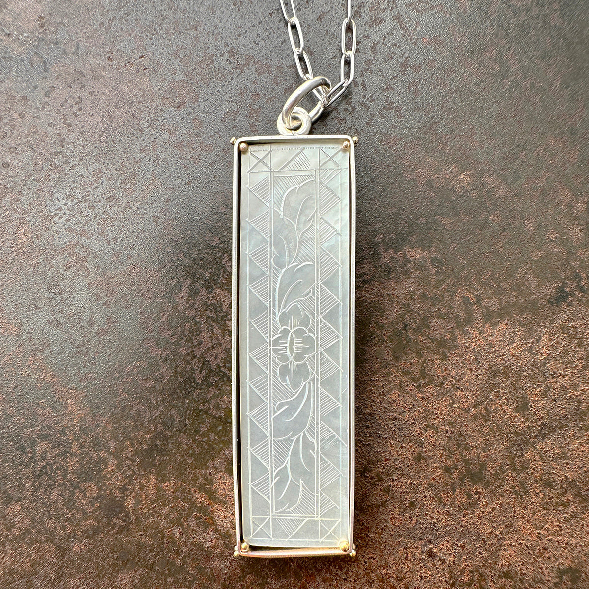 mother of pearl carved pendant with silver 3 way paperclip chain