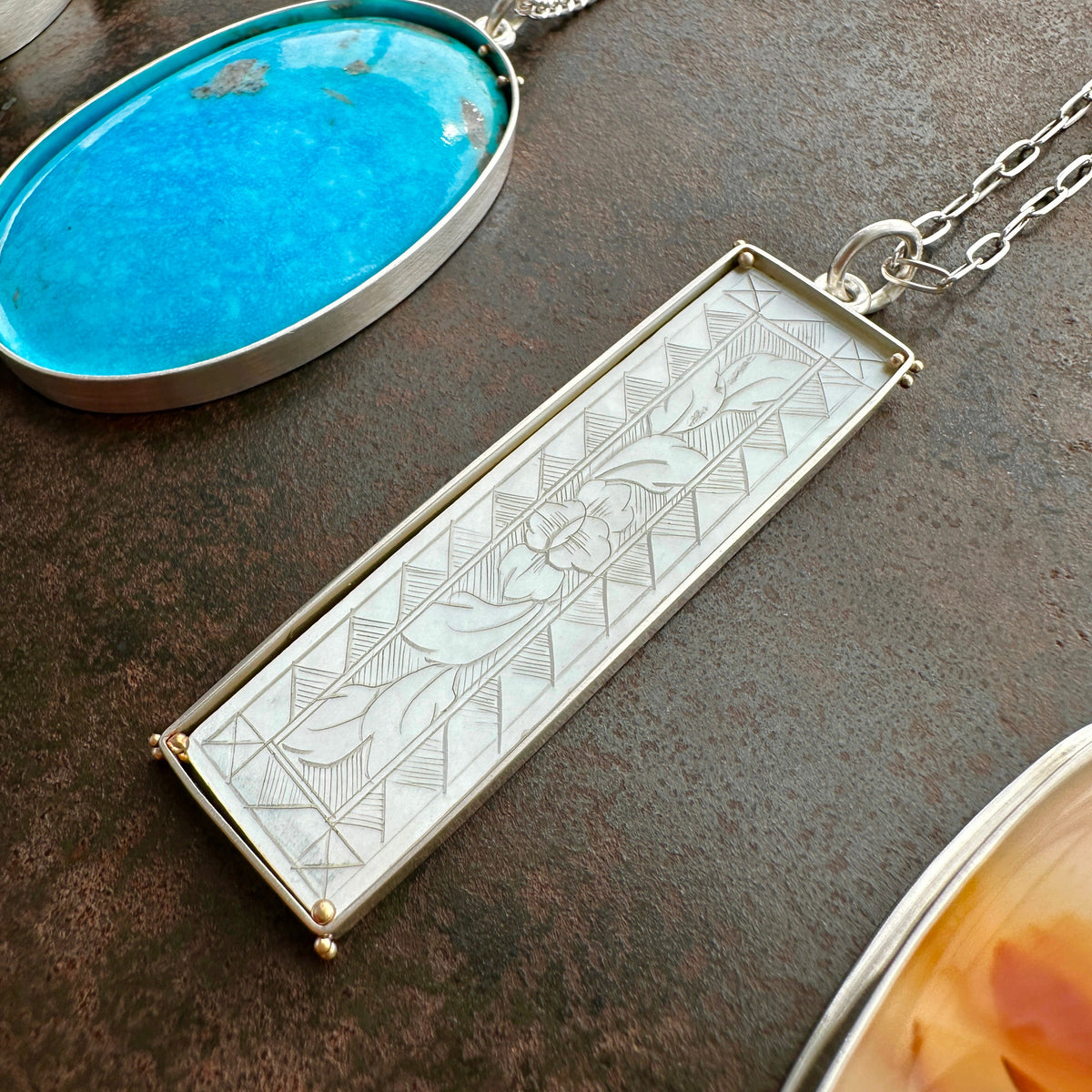 mother of pearl carved pendant with silver 3 way paperclip chain