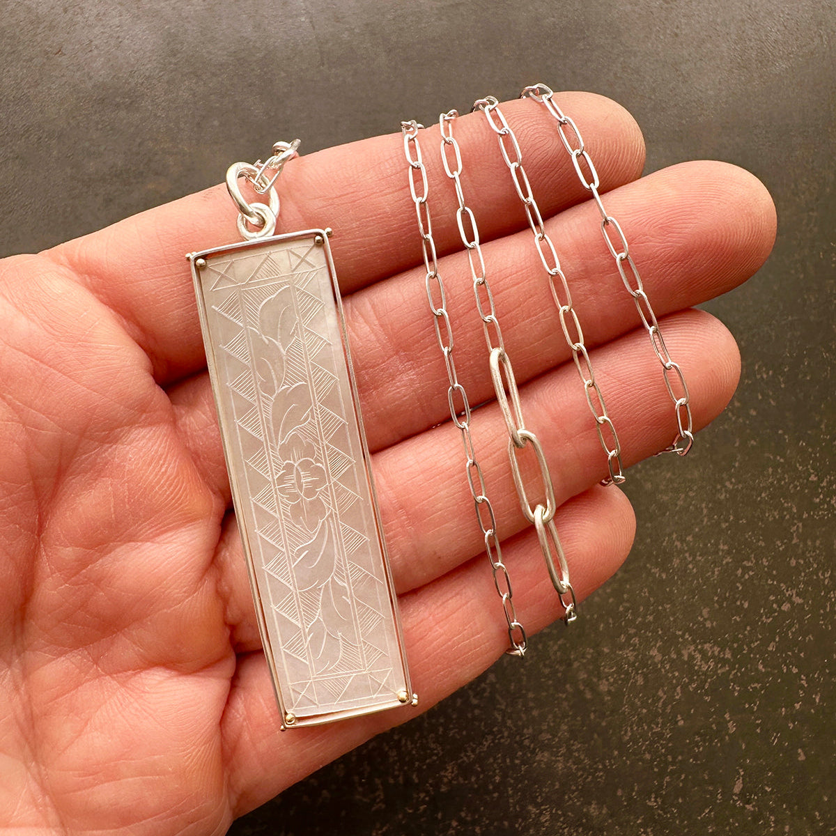 mother of pearl carved pendant with silver 3 way paperclip chain
