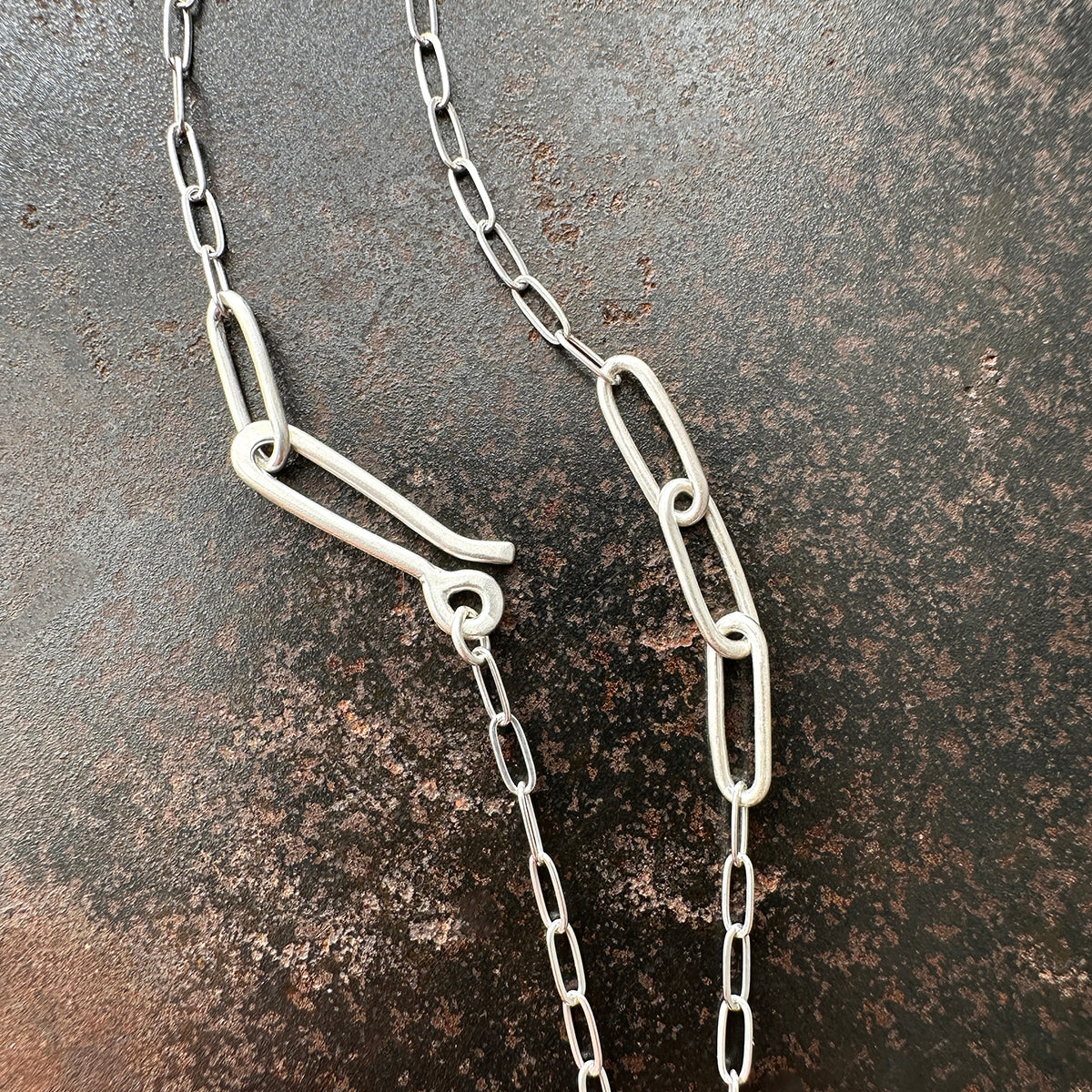 mother of pearl carved pendant with silver 3 way paperclip chain
