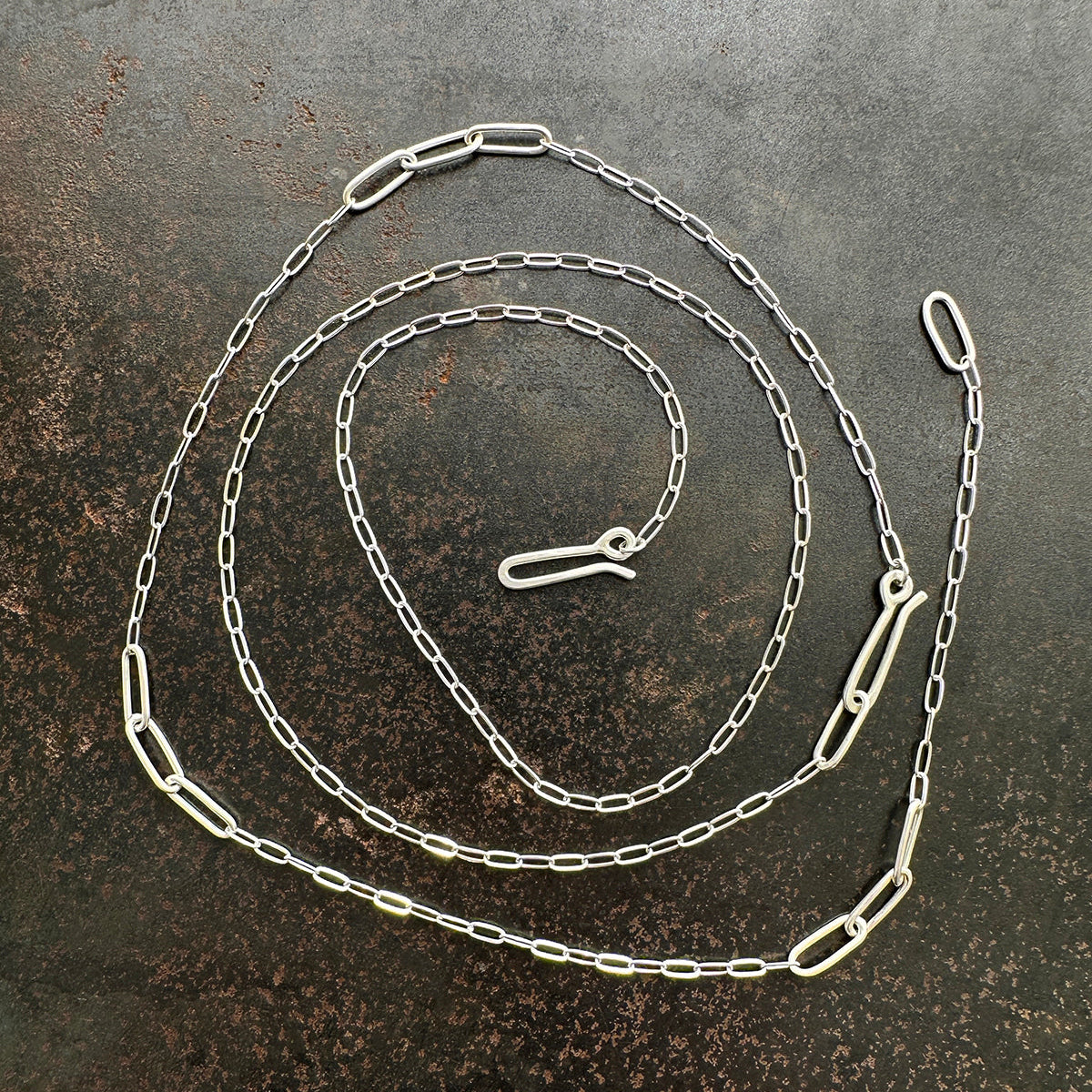 mother of pearl carved pendant with silver 3 way paperclip chain
