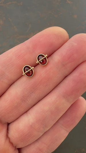 
                
                    Load and play video in Gallery viewer, garnet stud earrings, 14k gold stud earrings, hilary finck jewelry, fine jewelry, handmade jewelry, captured collection, gold jewelry.
                
            