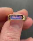 purple wood opal set in an 8k gold ring