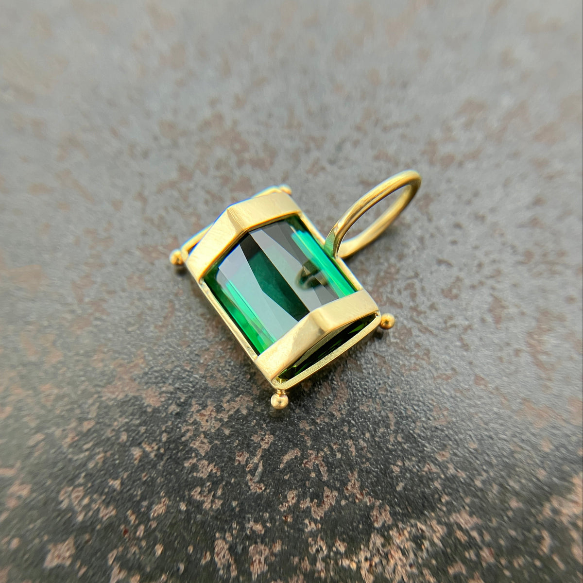 green radiant cut tourmaline pendant in 18k gold