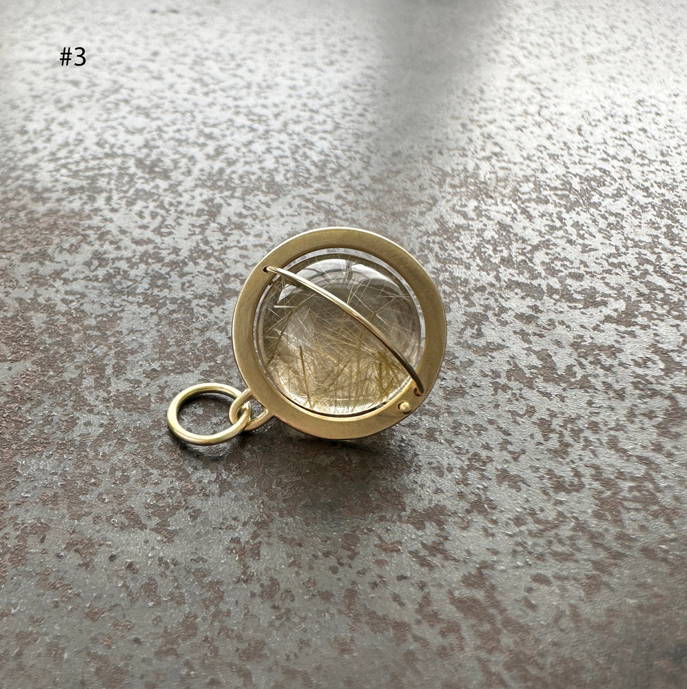
                
                    Load image into Gallery viewer, Captured Rutilated Quartz Orb Charm
                
            