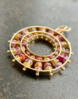 sapphire bead pendant with concentric circles of 14k gold