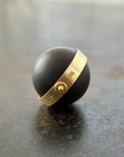 saturn agate orb with bands of color set in 18k gold