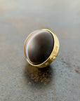 saturn agate orb with bands of color set in 18k gold