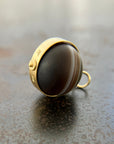 saturn agate orb with bands of color set in 18k gold