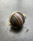 banded saturn agate pendant in 18k gold