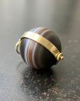 banded saturn agate pendant in 18k gold