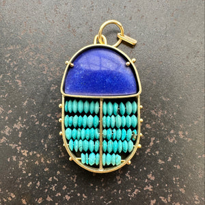 scarab shaped pendants of 18k gold, lapis, and turquoise beads