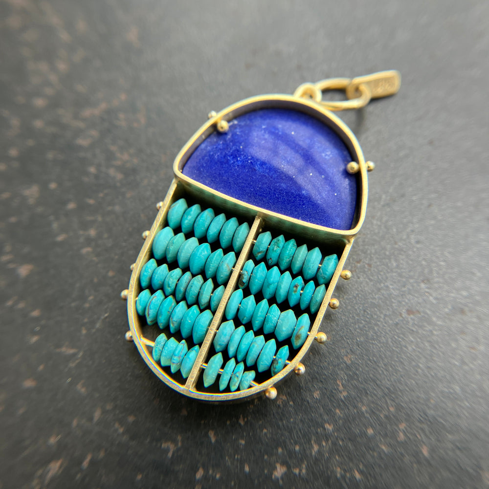 scarab shaped pendants of 18k gold, lapis, and turquoise beads