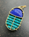 scarab shaped pendants of 18k gold, lapis, and turquoise beads
