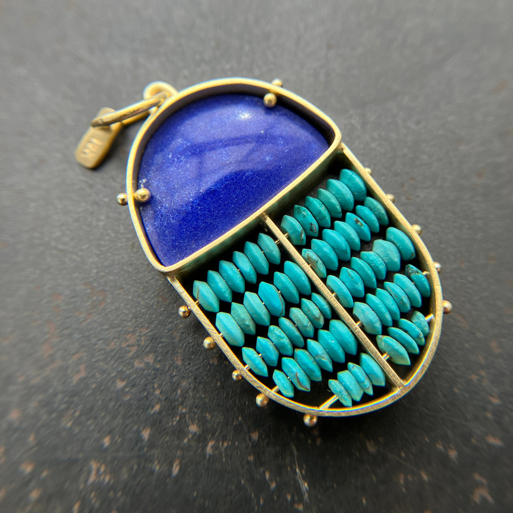 scarab shaped pendants of 18k gold, lapis, and turquoise beads