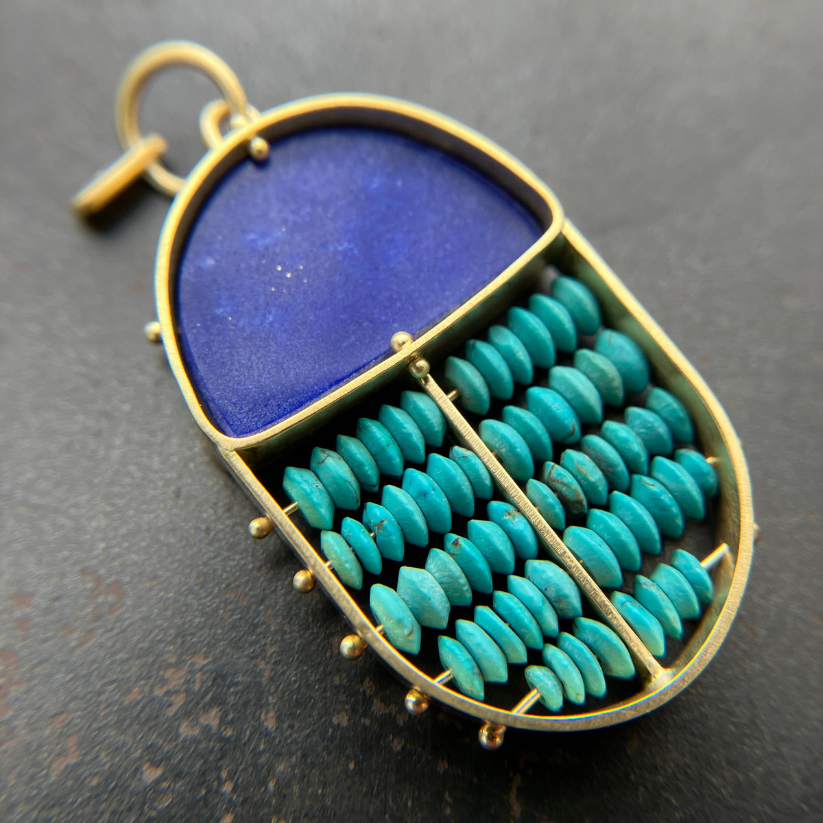 scarab shaped pendants of 18k gold, lapis, and turquoise beads