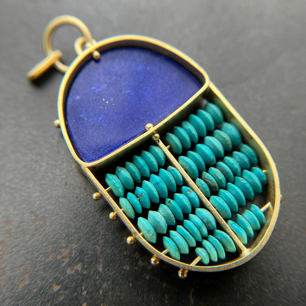 scarab shaped pendants of 18k gold, lapis, and turquoise beads
