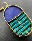 scarab shaped pendants of 18k gold, lapis, and turquoise beads