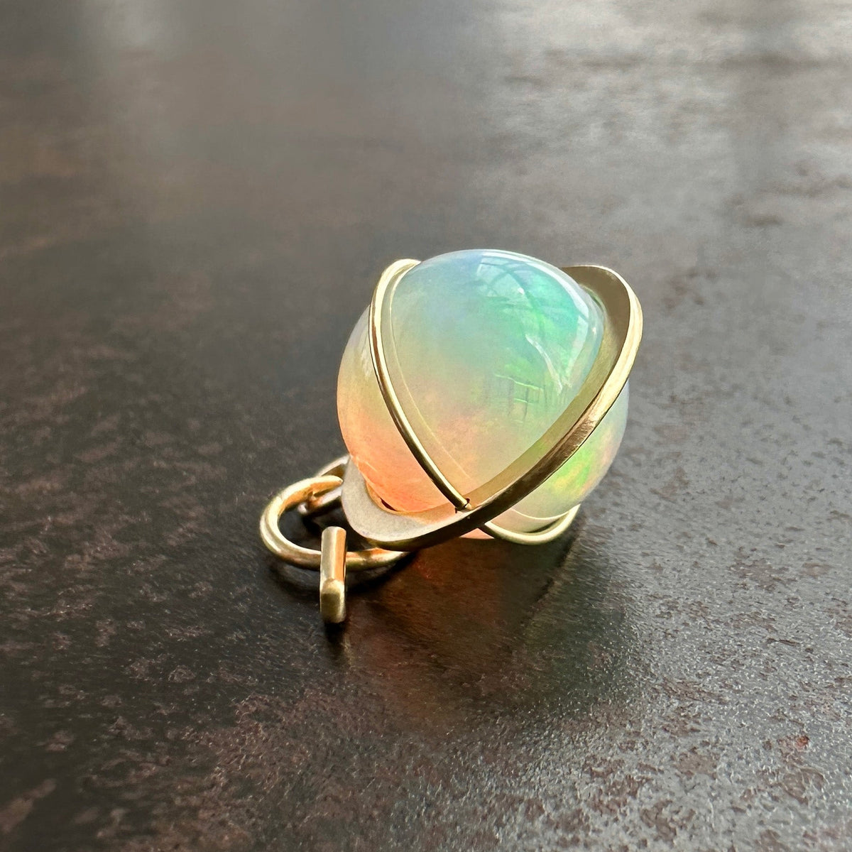 opal orb pendant Captured in 18k gold