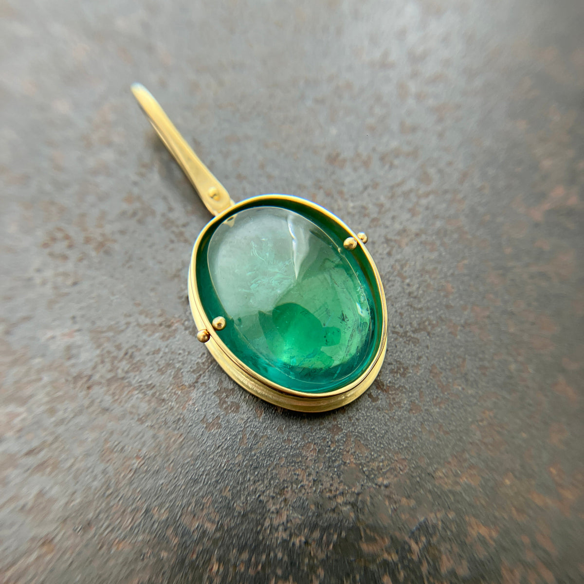 teal green tourmaline oval pendant in 18k gold