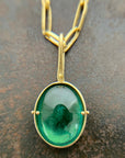 teal green tourmaline oval pendant in 18k gold with an 18k gold chain