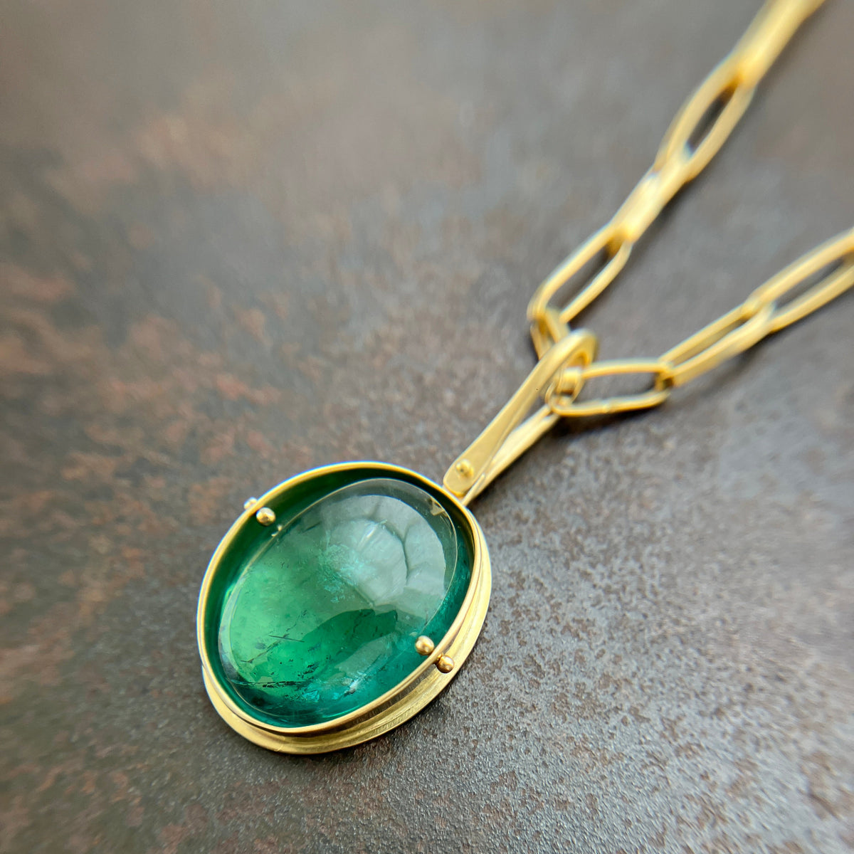 teal green tourmaline oval pendant in 18k gold