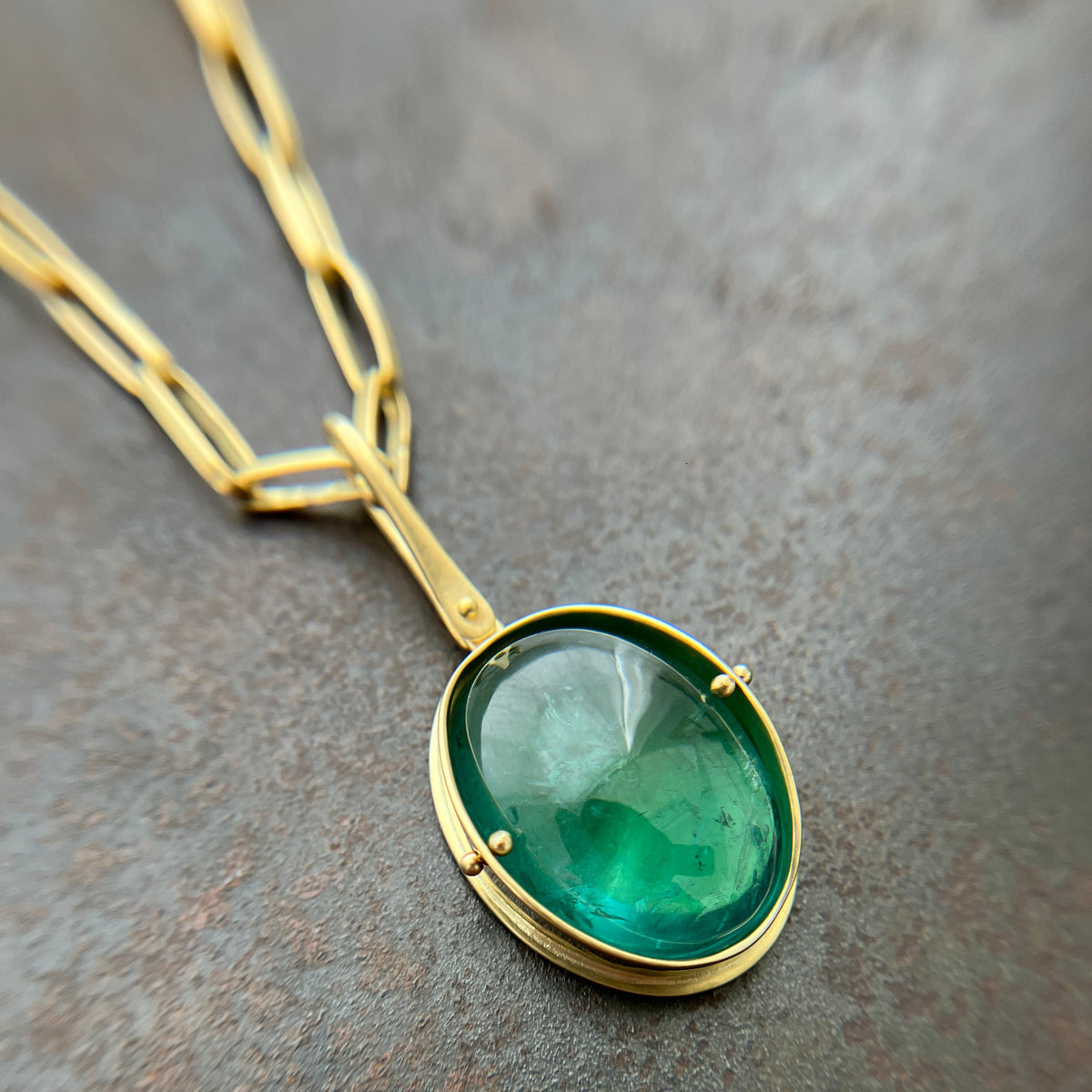 teal green tourmaline oval pendant in 18k gold