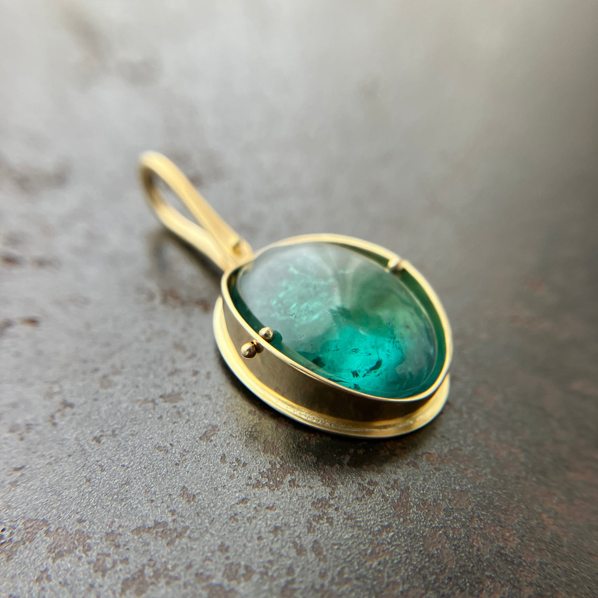 teal green tourmaline oval pendant in 18k gold