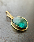 teal green tourmaline oval pendant in 18k gold