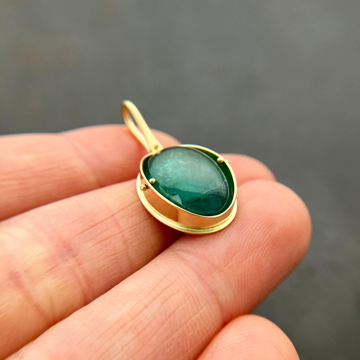 teal green tourmaline oval pendant in 18k gold