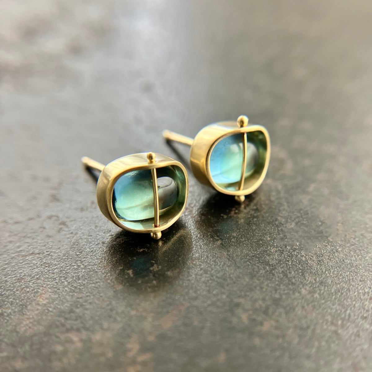 blue topaz stud earrings in 18k gold setting