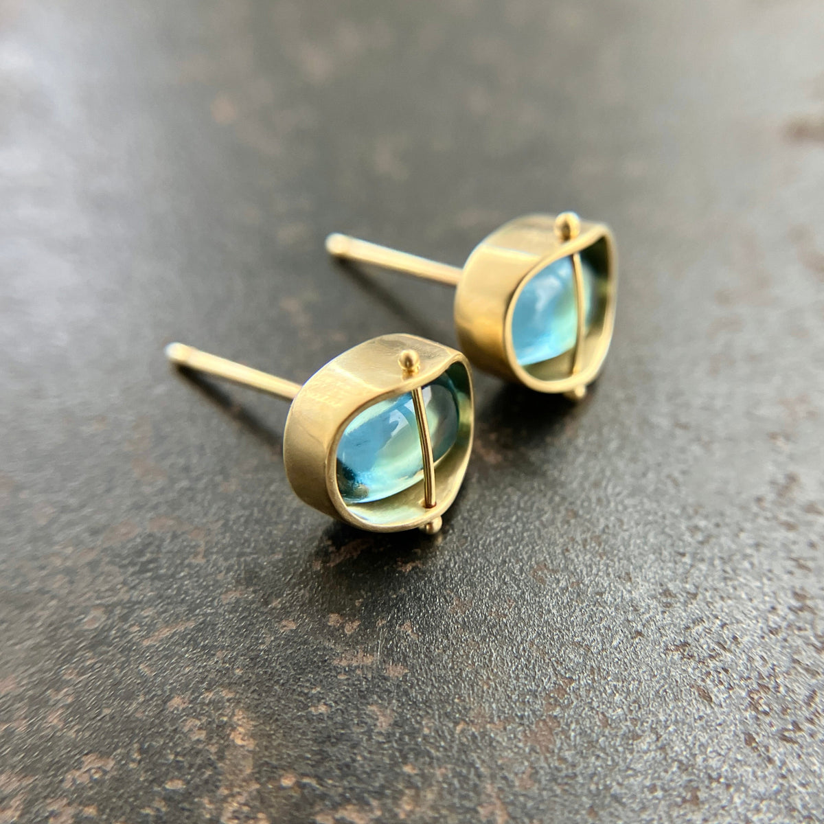blue topaz stud earrings in 18k gold setting