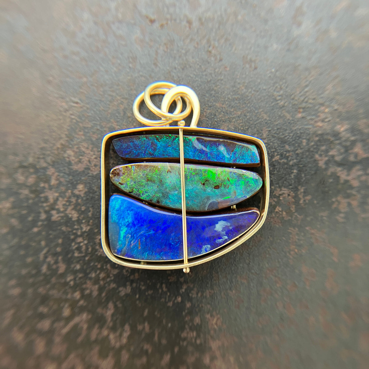 blue and green boulder opal pendant in 18k gold