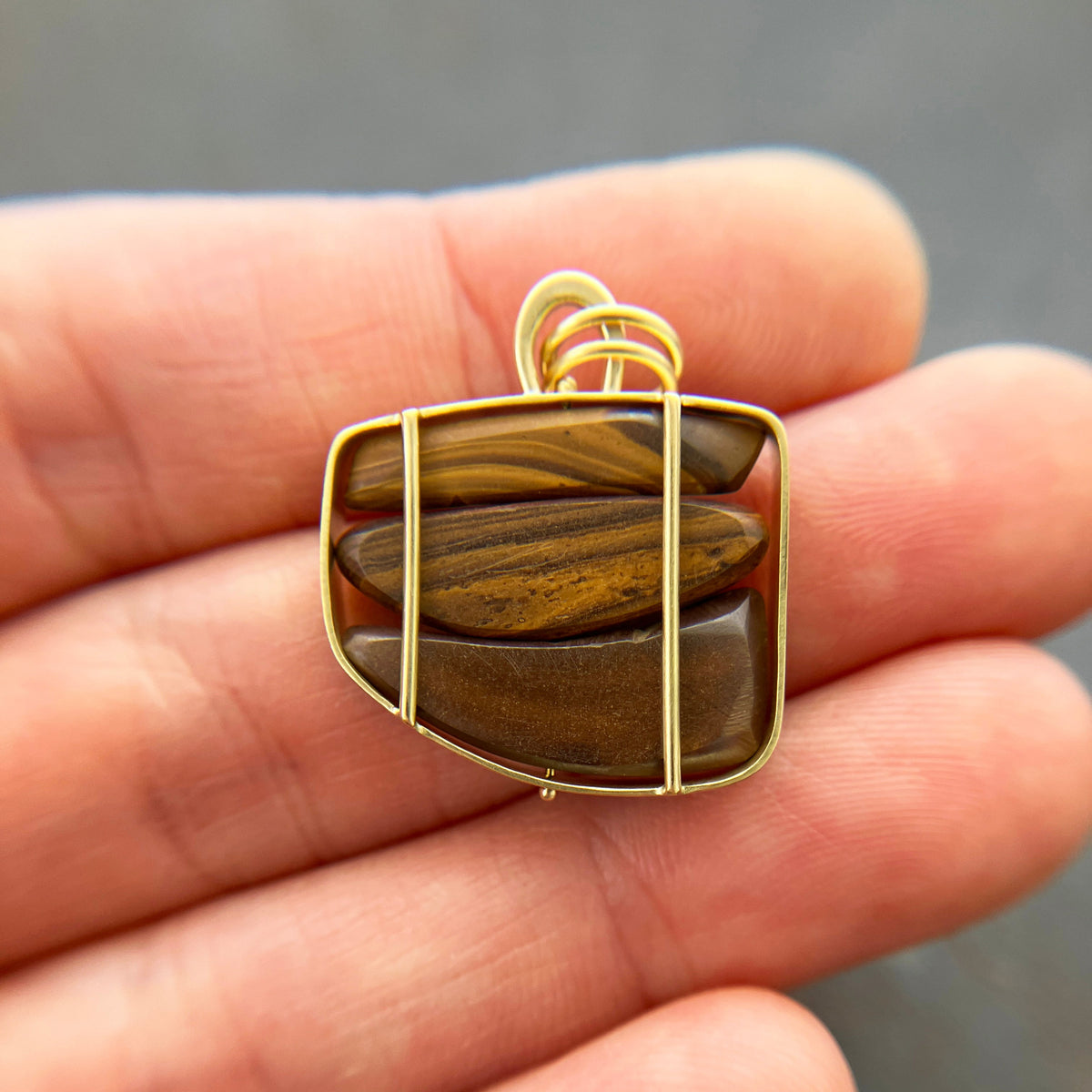 blue and green boulder opal pendant in 18k gold